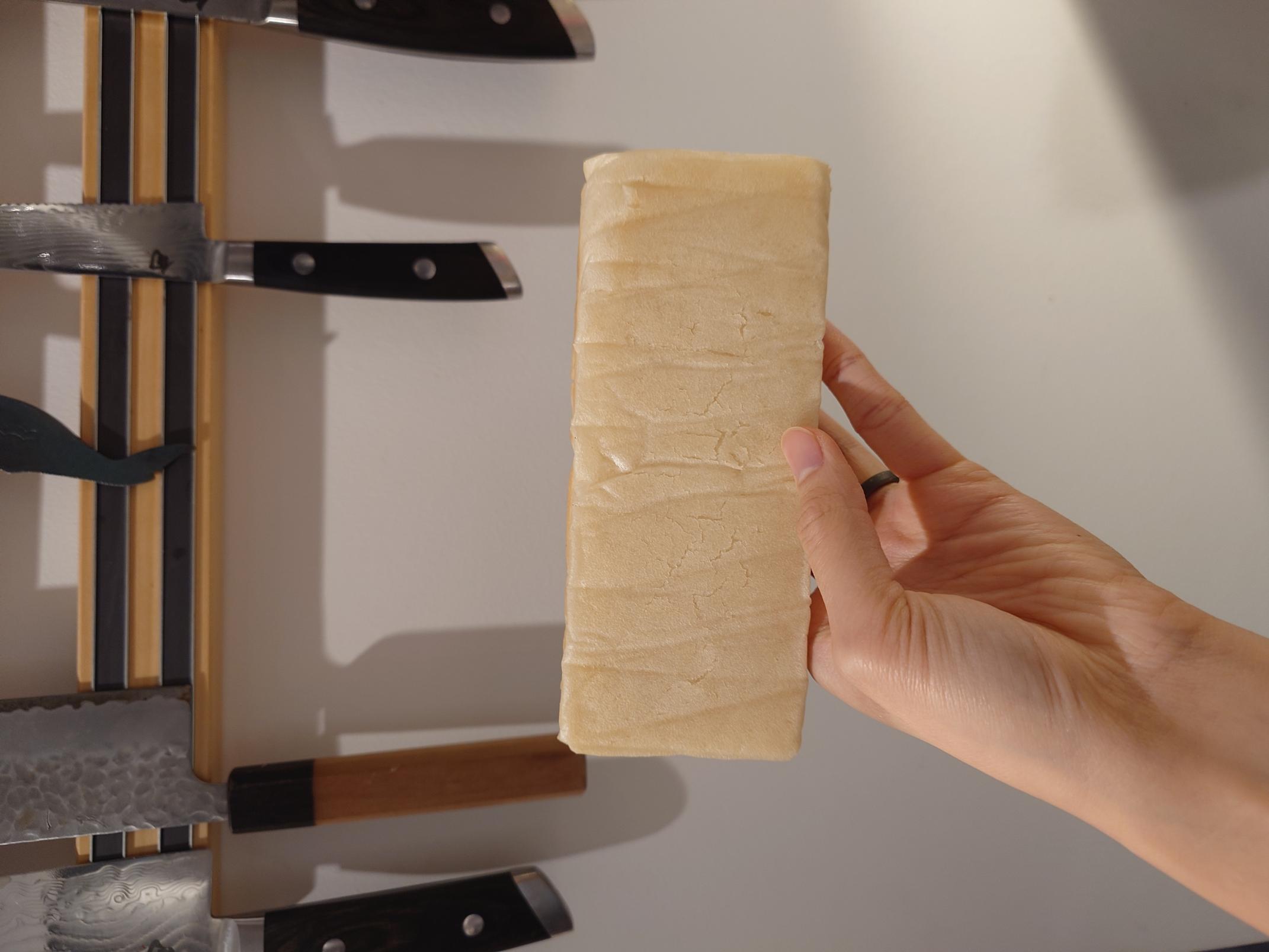 the bottom of a loaf of rice bread that looks very pale