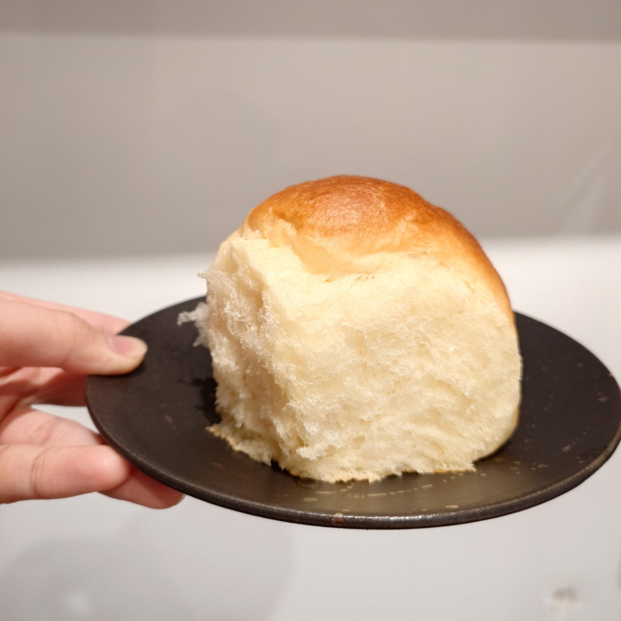 A milk bread roll on a plate