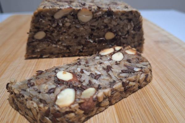 Slice of seed and nut loaf showing a slice