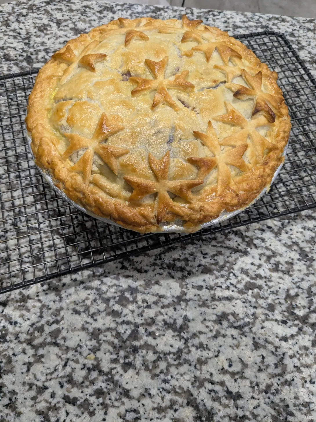 Maltese cross decorated cherry pie 