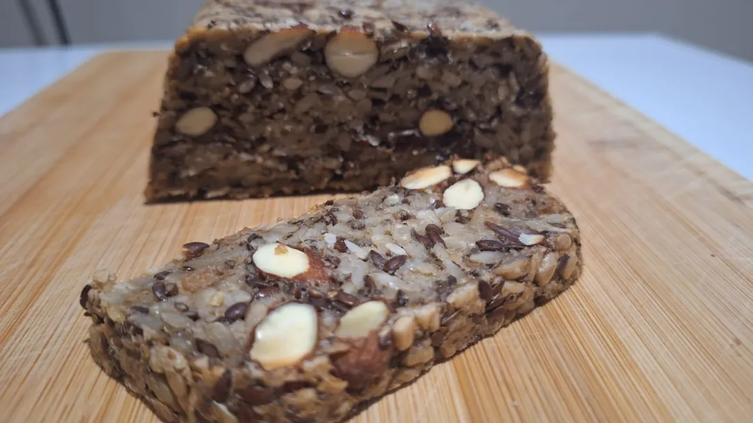 Slice of seed and nut loaf showing a slice