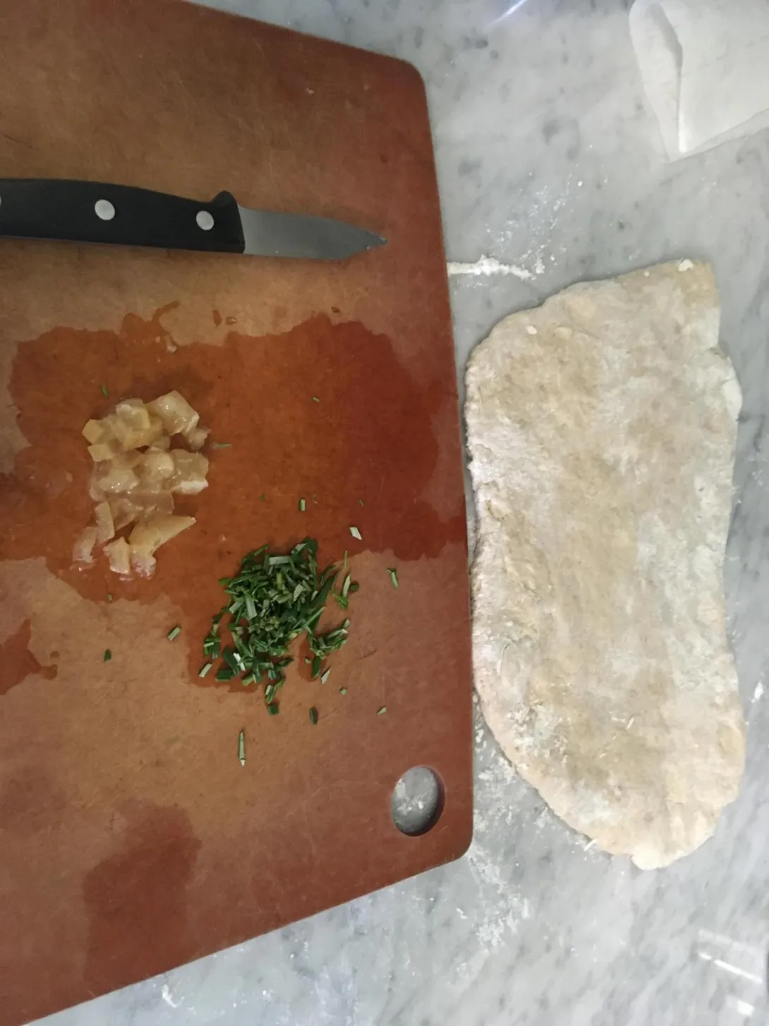 Rolled out bread dough, about 3cups to start, and minced lemon and r, 2Tb each