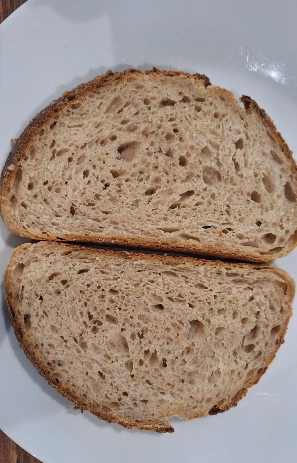 Sliced bread on plate showing crumb